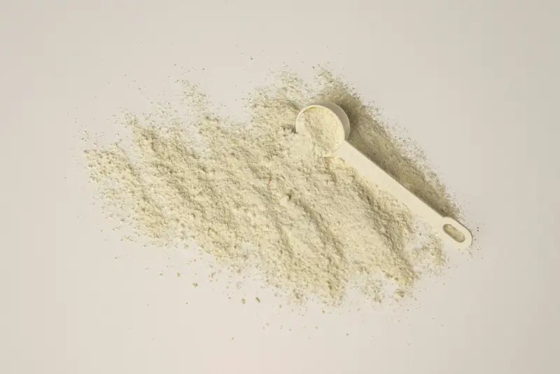 Ingredient powder with a measuring scoop (illustrative photo)